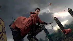 Hogwarts students in house competitions like Quidditch, showing rivalry.